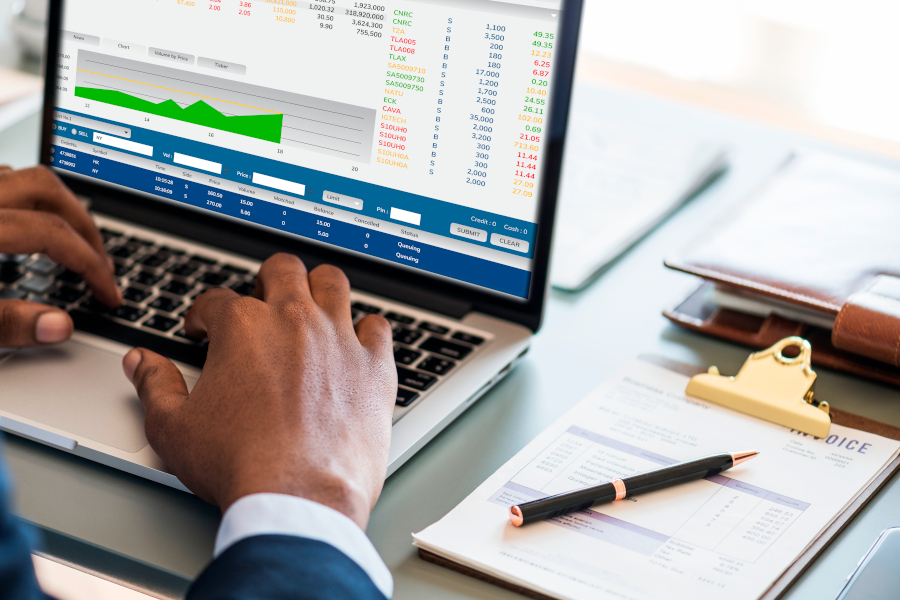 Serious businessman and businesswoman signing contract in boardroom. Young Caucasian female secretary showing papers to executive. Partnership concept